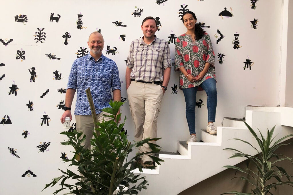 Photo of Greg Wallig (center) with Global Fund for Children's President and CEO John Hecklinger and Co-Chair Swatee Deepak (photo credit: Global Fund for Children)